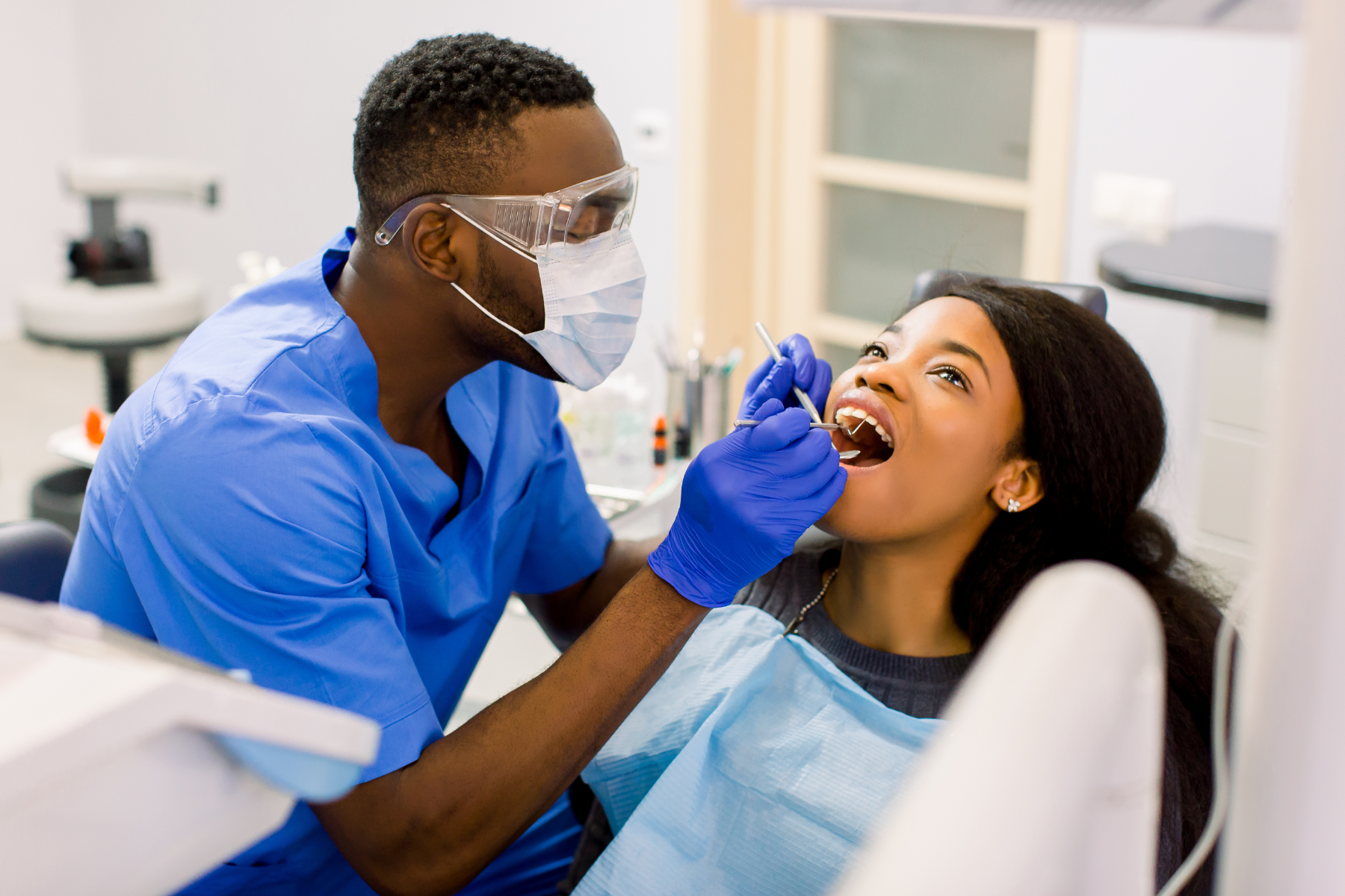 Dentist-working-on-pateients-teeth-cleaning_215707430